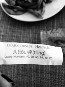black and white photo of the paper in my fortune cookie: it's the chinese word for headache