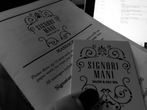 a black and white photo of a business card for Signori Mani a massage parlor 