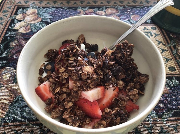 homemade dark chocolate granola over yogurt and berries 