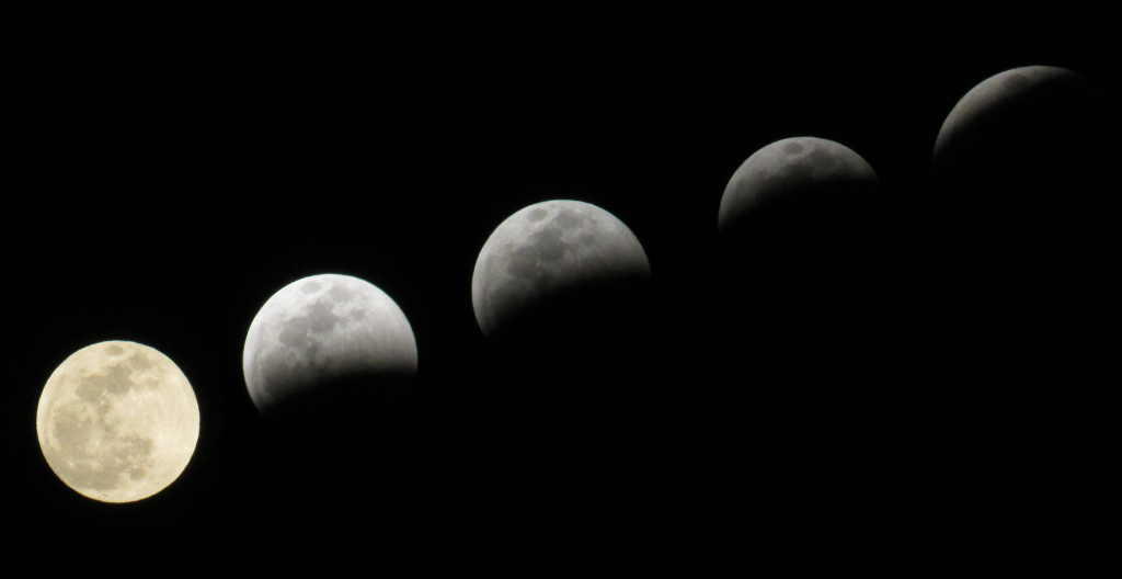 composite image of the full moon during five stages of a lunar eclipse. 