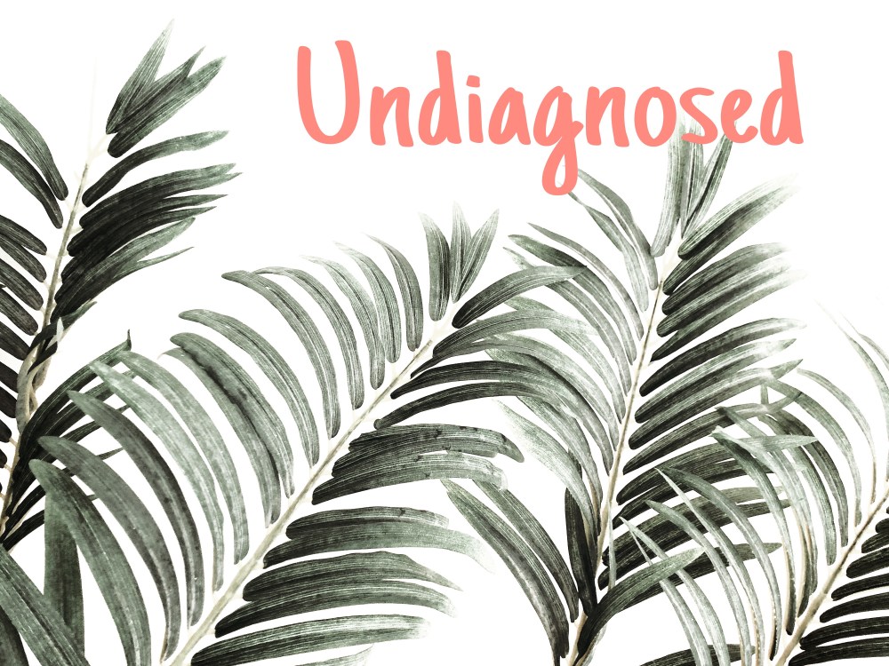 Fern like painted leaves across the base with light pink/coral text spelling out "undiagnosed"