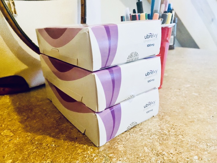 Three boxes of medication Ubrelvy stacked on top of each other